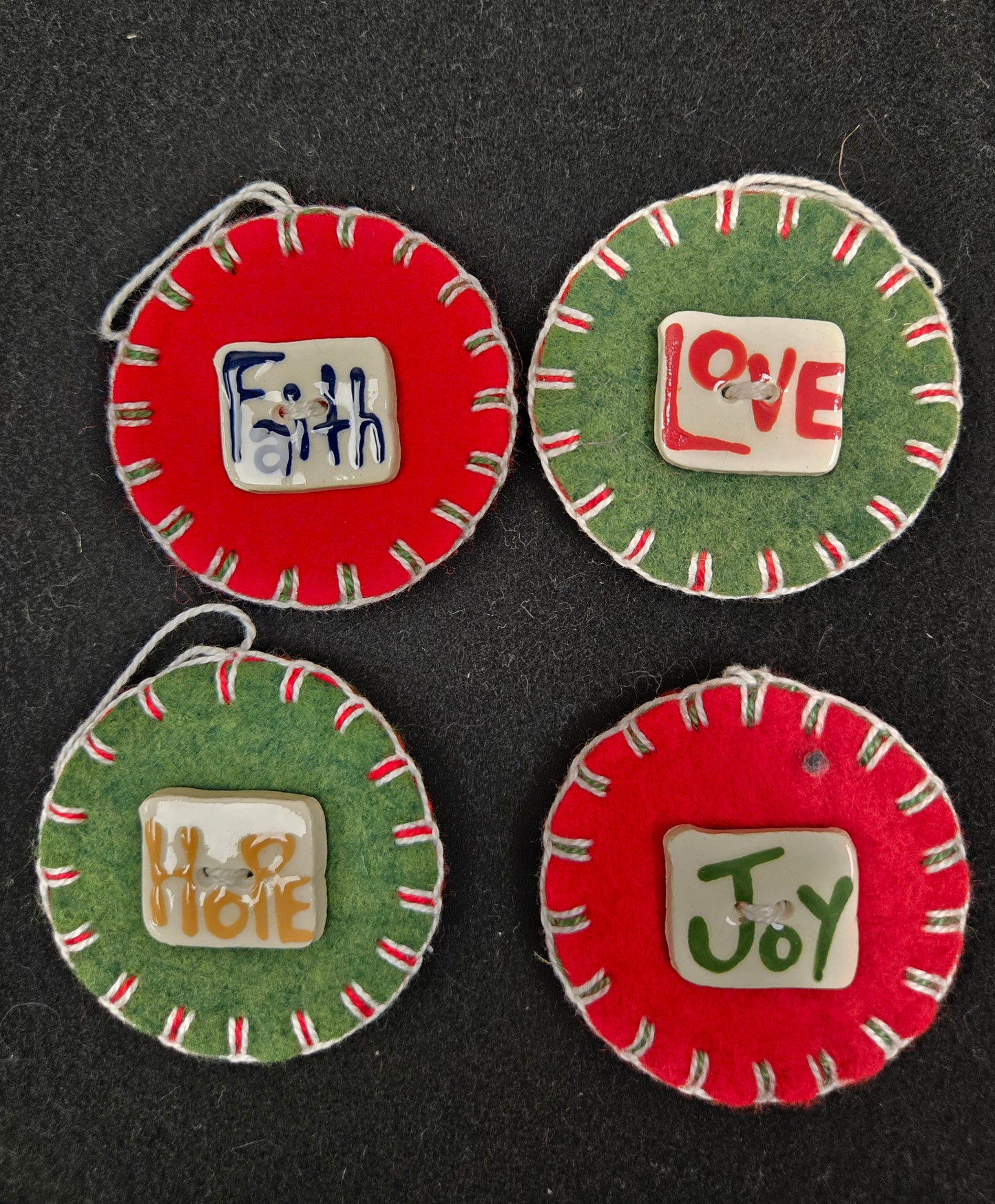 Set of wool or wool felt penny ornaments